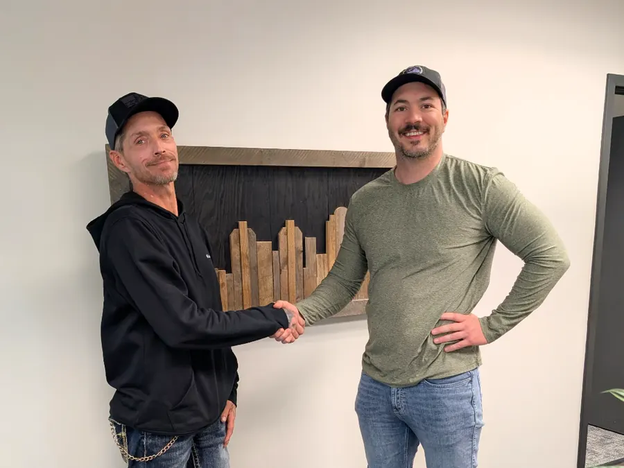 Dan shaking hands with a seller after closing